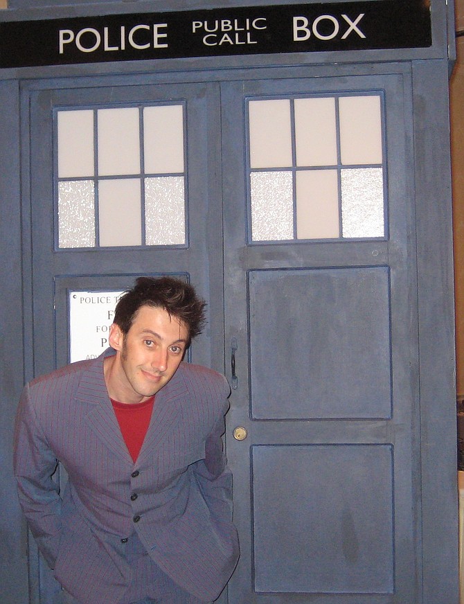 10nant Cosplay posing with Tardis