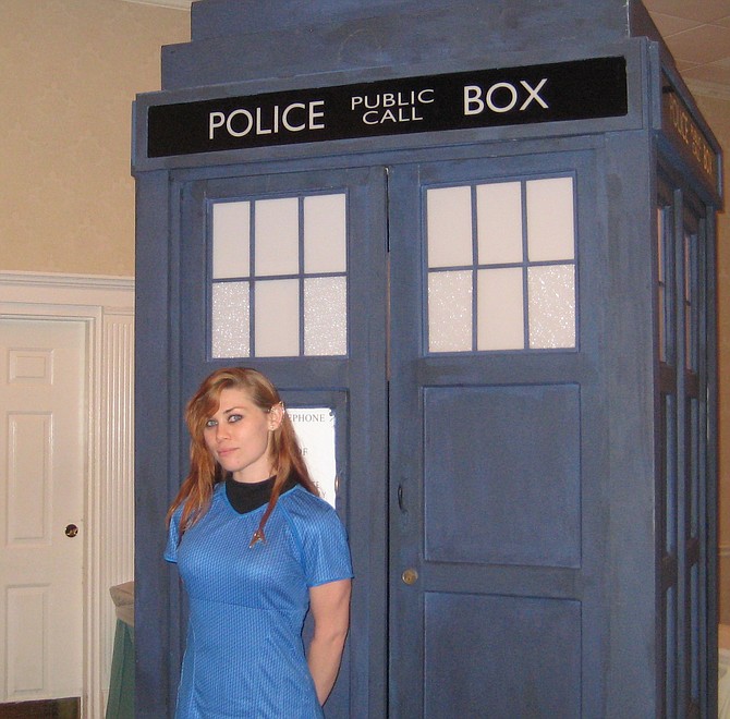 Kat Sky in Star Trek costume posing with Tardis 