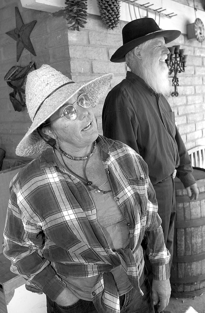 Sally Snipes and Clint Powell. "When we were evacuated, the only things I took were my computer and my piles of weather records."
