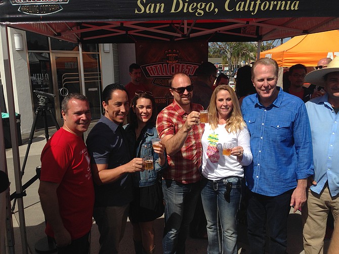 Mayor Kevin Faulconer and Councilman Todd Gloria celebrate the arrival of craft beer tasting at Hillcrest Farmers Market.
