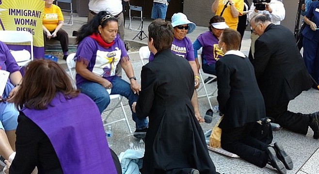 The march concluded outside city hall with a rally and clergy washing the feet of janitorial staff.