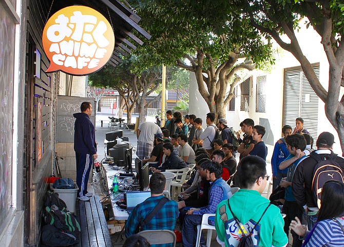 Outside the café, a Smash Bros. tournament
