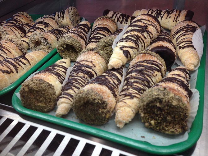 Baked-on-site scones filled with Bavarian custard, glazed with chocolate and a pistachio crust