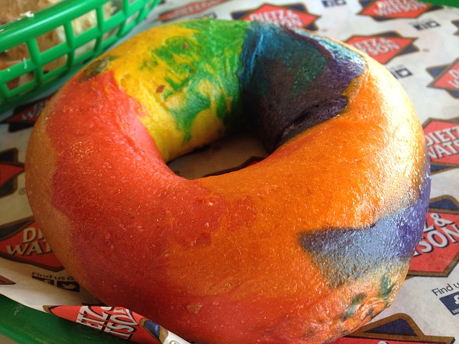 A rainbow-colored plain bagel