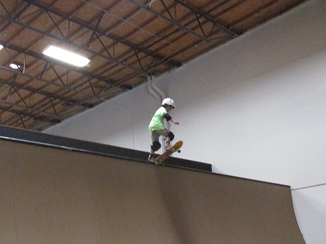 A young skater gets ready to drop in on the new 11.5-foot half-pipe