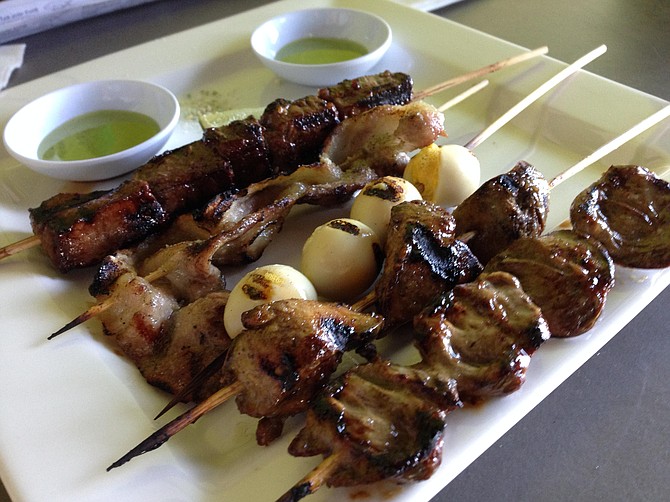 Vietnamese skewers, left to right: filet mignon, pork belly, quail eggs, chicken livers, and chicken hearts