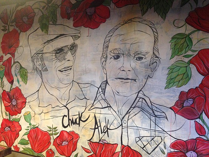 A mural at the ChuckAlek Biergarten depicts the owners' respective grandfathers, Chuck and Alek.