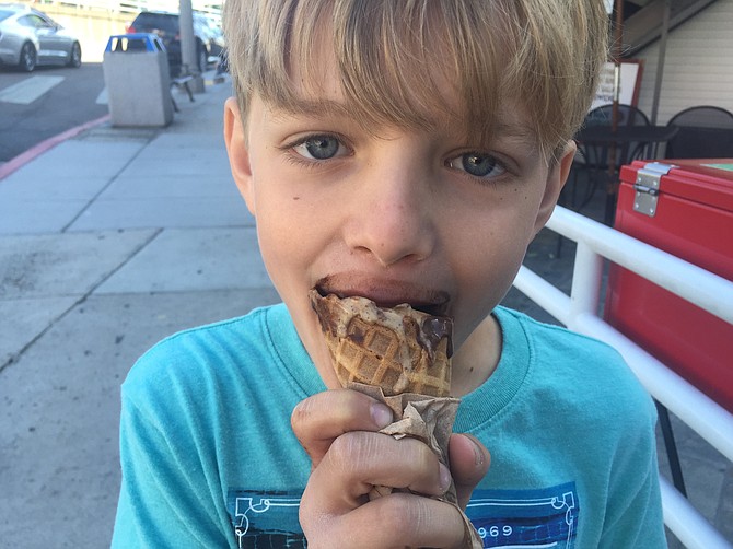 The author’s happy son enjoys a scoop of Chocolate Sorbet and Moka, a blend of espresso and chocolate chips