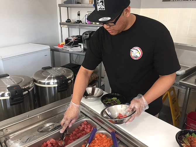 Poke is made by mixing raw fish with a soy-based sauce. San Diego Poke Company has seven choices of sauce.