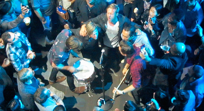 A kumbaya moment — the band formed a semi-circle in the audience and played an acoustic rendition of 2009’s Grammy Award–winning “Hello Hurricane.”