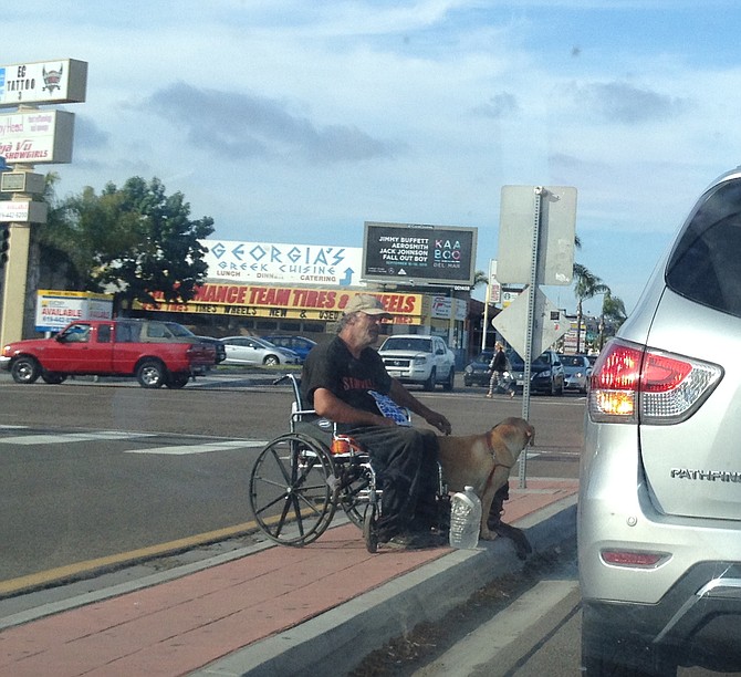 Peaceful median panhandler in Midway District.