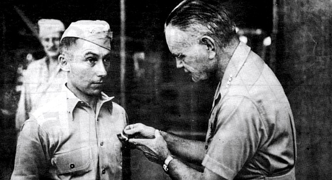 Admiral William Halsey awarding Navy Cross to Victor Krulak, Soloman Islands, 1943. Krulak had been ordered by Halsey to conduct night-time amphibious raids.