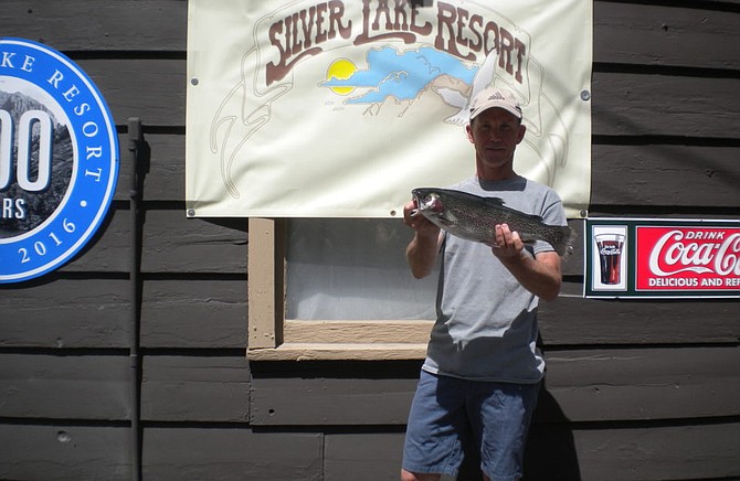 Glen Jones of San Diego hauled in this 3 pound 5 ounce Rainbow caught from a boat on Silver Lake using Berkley Mice Tails