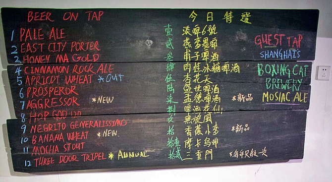 Craft beer is making gains in China: a chalkboard menu at Beijing's Great Leap Brewing features guest beers from Shanghai's Boxing Cat. 