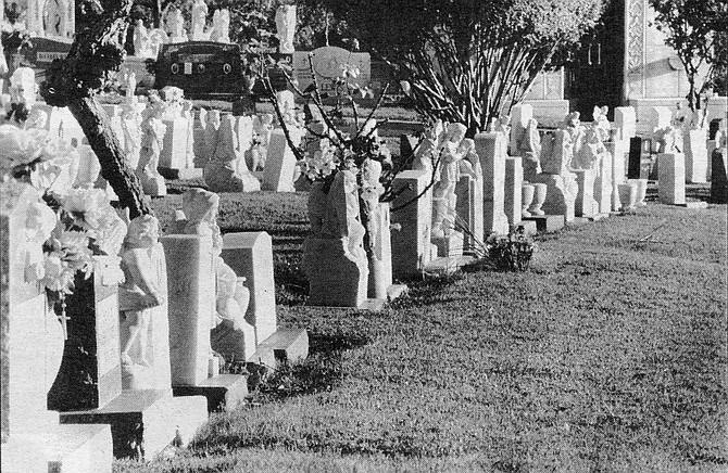 Children's gravestones, Holy Cross Cemetery. Mostly, I tell this story for all the burning bad boys and girls out there, all you killers in your khakis and Impalas, all you rucas with your big hair and you dead-eyed young vatos with your little tattoos and mustaches.
