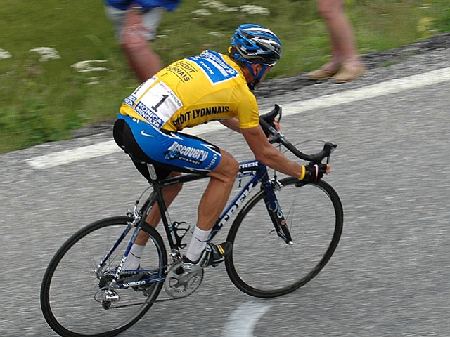 Armstrong wearing the yellow jersey at the 2005 Tour de France. Today is the Tour's first Alpine climbing day, 120 miles long with a rise from 721 to 6,574 feet. 