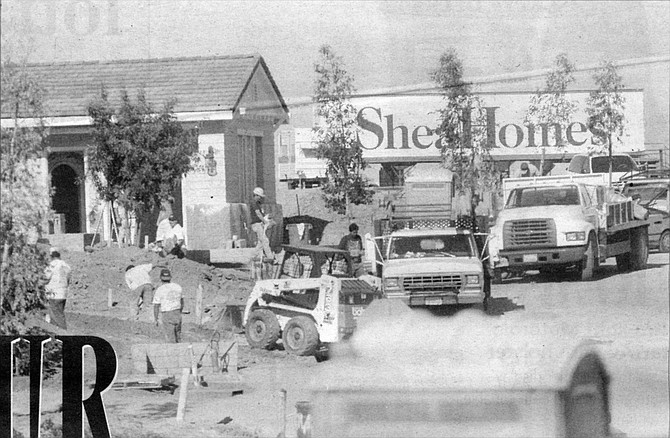 Construction site of Shea Homes, Encinitas. The sign at Via Cantebria that, in early 1998, advertised homes selling “from the high three hundreds” now said “from the mid-four hundreds.”  - Image by Sandy Huffaker, Jr.