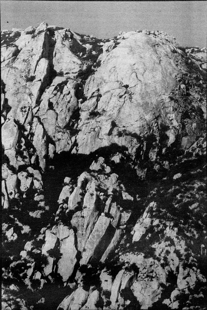 The cliff on El Cajon Mountain. Our original plan included a bivouac near the cliff; we had hoped to shed all excess gear and do several routes in shorts and climbing shoes. One glance at our water supply and I knew multiple routes were out of the question. - Image by Robert Burroughs