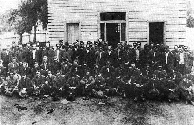 Captured wobblies under guard at Old Town school. Eighty members of the IWW were arrested in the Old Town area over the next several hours and rifles were passed out among the vigilantes.