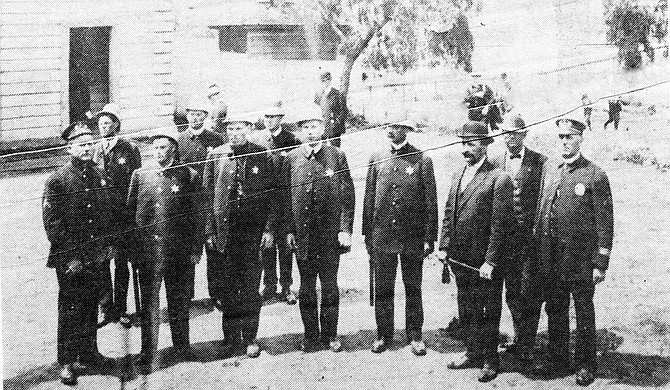 Group of San Diego policemen, ready for IWW demonstrations.  The board of supervisors  authorized a mounted force to patrol the Orange County line and drive back Wobblies attempting to reach San Diego.