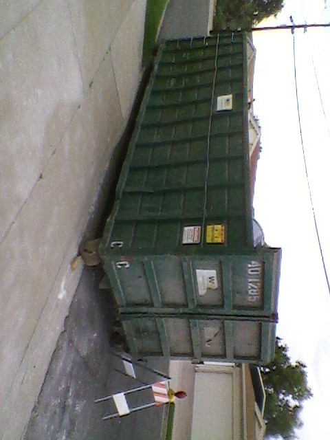 Dumpster containing fire damaged home contents.