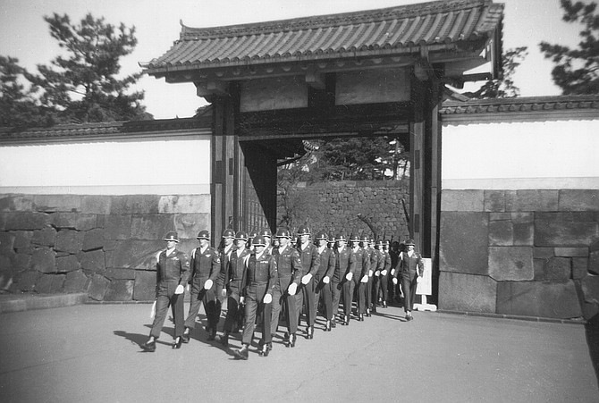 MacArthur's honor guard, Tokyo. "We wore tailored uniforms and blue silk scarves we tucked into our collars, and we had special things in the legs of our pants to keep the creases straight."