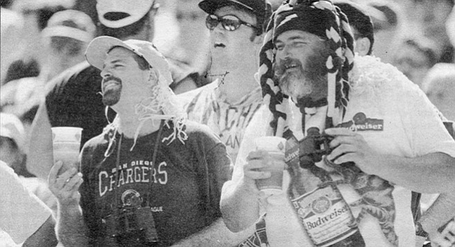 Fans at Chargers-Ravens game, September 28, 1997. Most things on television are moronic and violent, but these players aren't actors; the violence is real and we are invited to participate.