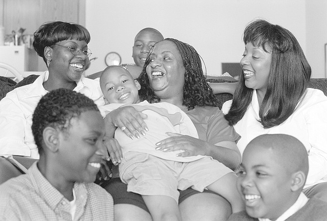 Ruby (center) holding Szongaia, clockwise from top: John Malcolm (Sherley's grandson), Jacquelyn, Arreon, Javon Malcolm (Sherley's grandson), Evangeline