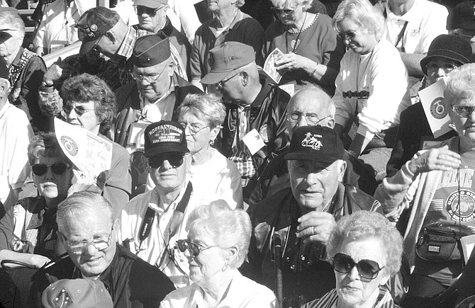Korean war veterans and their spouses at Camp Pendleton, December 2000. The crowd thundered its approval with applause, whistles, and the Devil Dog growl.