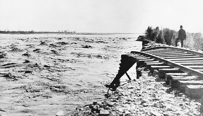Imperial Valley, 1905. Dynamite strapped to his back, Meadows dogpaddled downstream, dodging everything from angry rapids and tree trunks to dead animals.