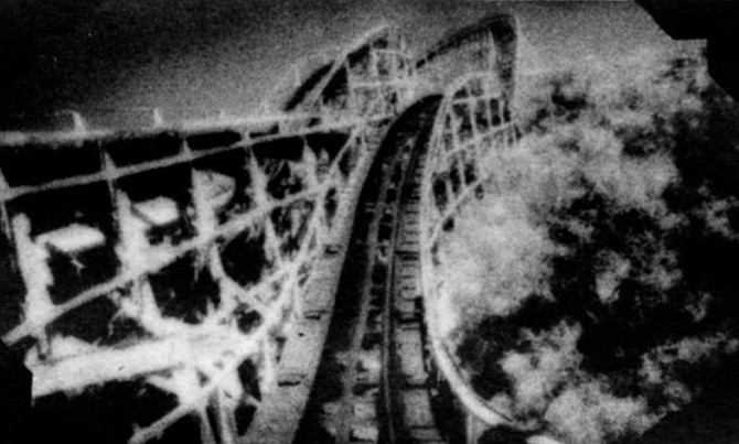 Belmont Park rollercoaster. The click of the chain would split the ocean air as the cars ascended; the rattle of the rail would resonate through the concession buildings and rumble in the pavement. 