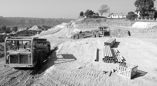 Development of Halifax. Bulldozers are grading land into terraces on which will sit 25 new homes. - Image by Joe Klein
