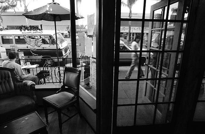 Adams Avenue, from inside Lestat's. "It seemed that three out of every five homes south of Adams Avenue in Normal Heights were in the process of being remodeled or had already been remodeled."