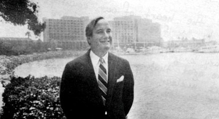 Armand: Here is a picture of Mr. Roberts, the hotel's manager. He's standing beside the marina with the Sheraton in the rear. --E.