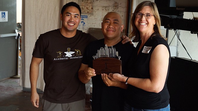 RJ Ocubillo and Mike Arquines accept one Mostra Coffee's Cold Brew City trophies from San Diego Coffee Network Event Director Kathy Myers.