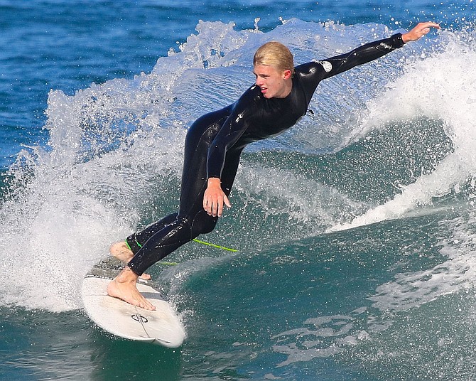 Surf Rider

Young surfer at Moonlight Beach in Encinitas, San Diego, CA.
