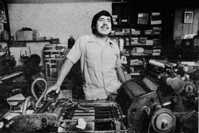 Herman Baca in his shop. It’s certain that his business is slow. He seldom prints more than half a day at a time.