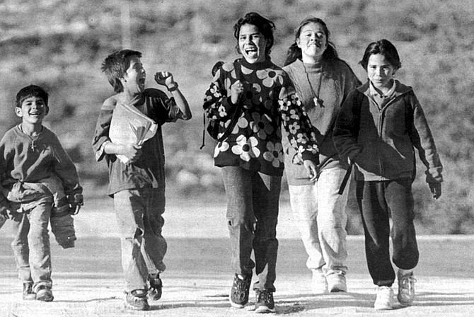 Kids walking home from school, Jacumé. Citizens of each country have been free to cross the border whenever they wished. Mexicans have gone north to pick up their mail at the Jacumba Post Office, shop, find casual work.