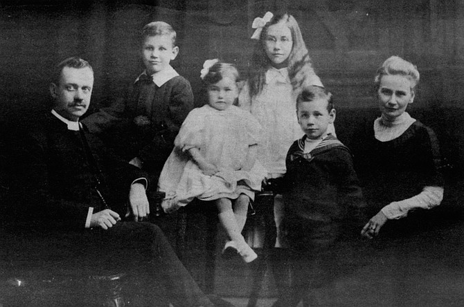 Family portrait, John on right (ca. 1911). Theobald became a classmate of Eric Liddell, the champion sprinter portrayed in the movie Chariots of Fire.