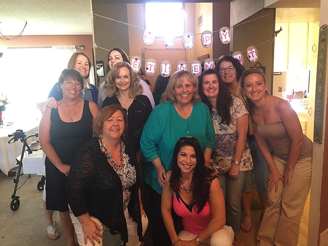 My mom with coworkers at her retirement party
