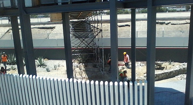 Construction of a permanent walkway continues on the Mexican side of the border