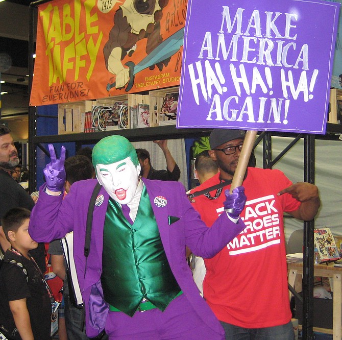 Trump Joker posing with Black Heroes Matter man