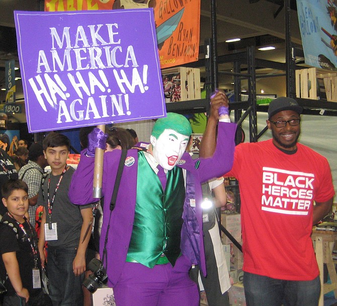Trump Joker posing with Black Heroes Matter man