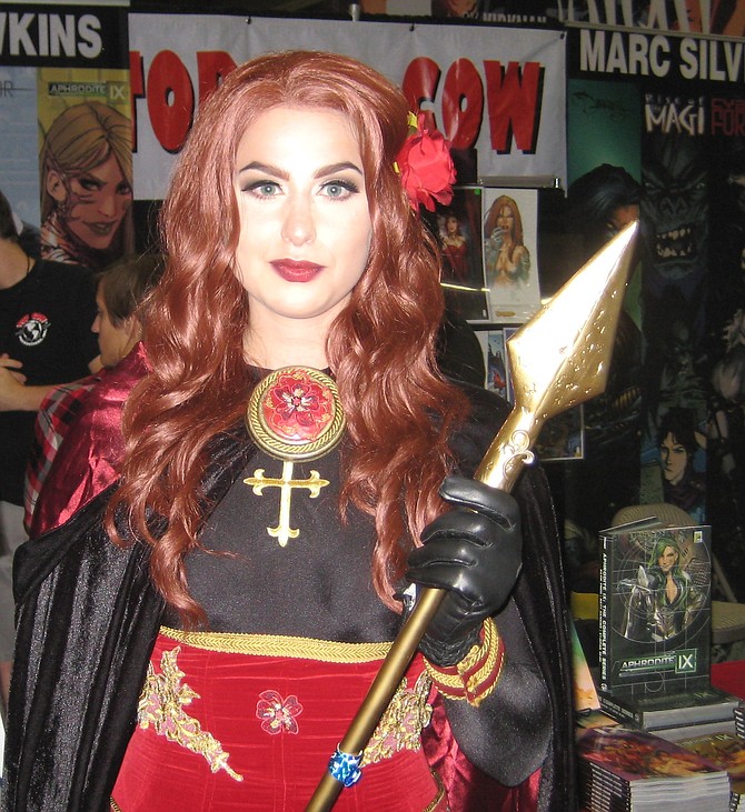 cosplayer in front of Top Cow Productions booth