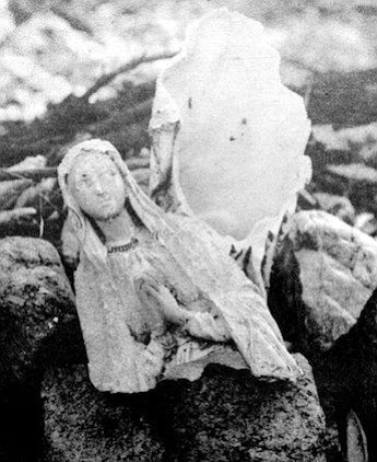 Broken statue of Virgin Mary