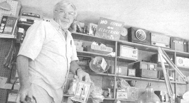 Tom Jones at his Mission Hills repair shop: clock radios, coffeemakers, water filters, vaporizers, humidifiers, computer manuals, an ice cream maker, an Electro-Lux vacuum-cleaner cylinder that is so old it looks like something from Jules Verne's imaginary sketchbook, electric frying pans, racks of extension cords, floppy disks, light bulbs, an electric hot-dog cooker. - Image by Joe Klen