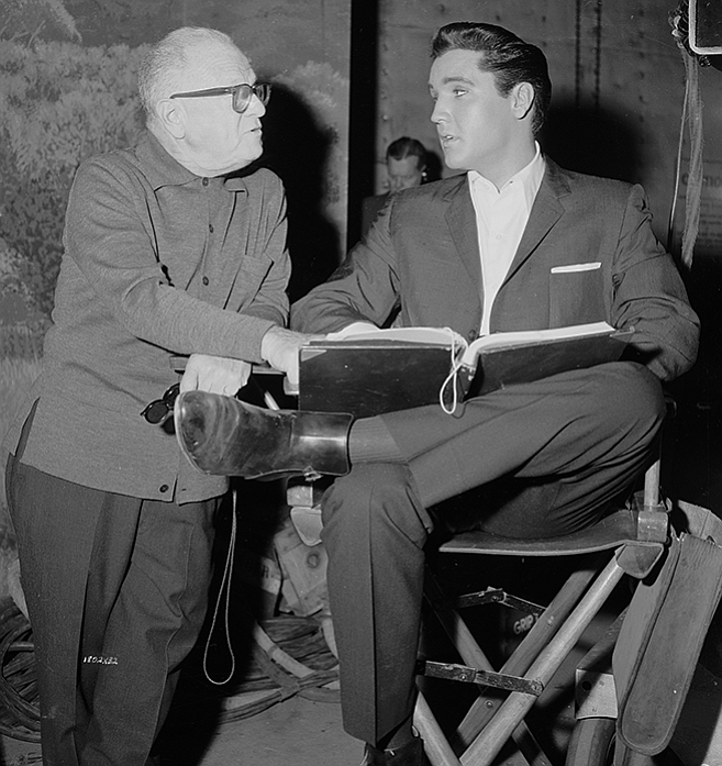 Elvis consults with director Norman Taurog