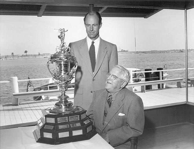 Gary Gould (standing) and Alonzo Jessop with yacht club trophy, 1953. Commodores of the club include Jessops, Goulds, Frosts, Frazees, Kettenburgs who have steered local history for the last 114 years.