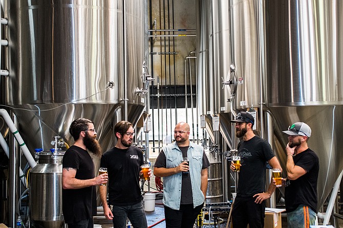 Dead Feather moon bandmates gather at the Saint Archer brewery to make beer.
