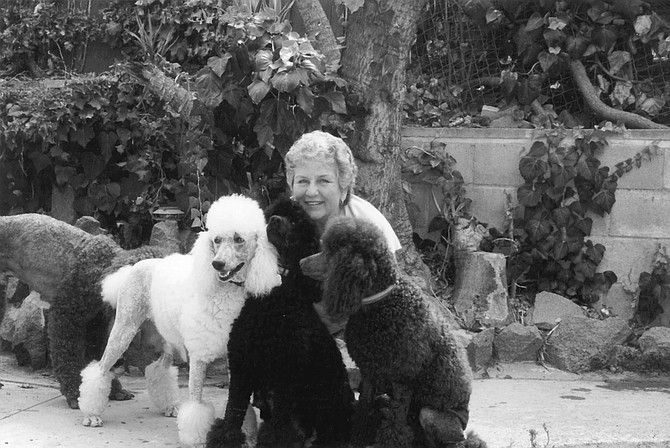 Jan Gelin with Willow, Jet, and Tutti. “I have dogs in La Jolla, Beverly Hills — very wealthy people buy my dogs." - Image by Sandy Huffaker, Jr.